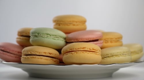Colorful Macarons Rotating on a Plate