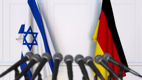 Flags of Israel and Germany at International Press Conference