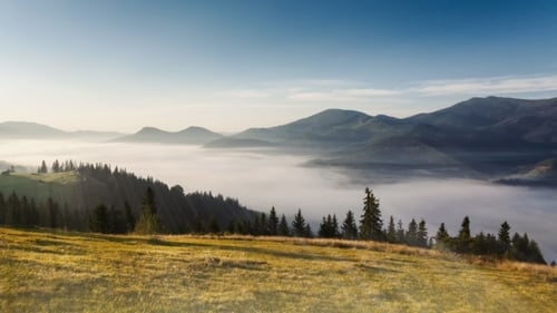 Mountains in Ukraine Early Morning with Fog and Ray Light