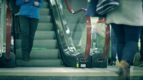 Unrecognizable People on Moving Staircase of a Metro Station
