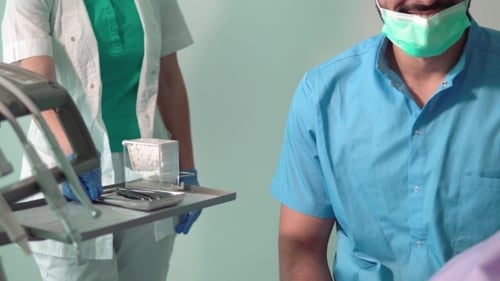 Dentist Takes Mouth Mirror