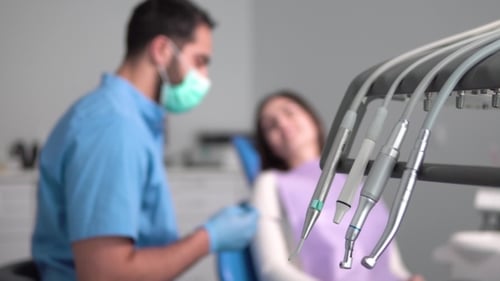 Dentist Talks To Patient During Check Up