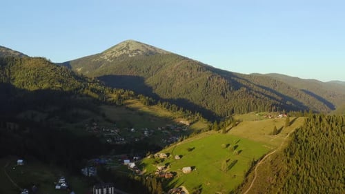 Flight Over the Village in the Carpathian Mountains in Summer