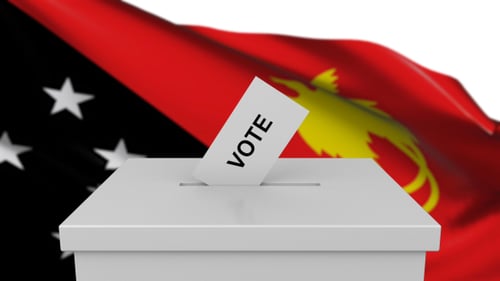 Vote Casting in Ballot Box with Waving Flag Background