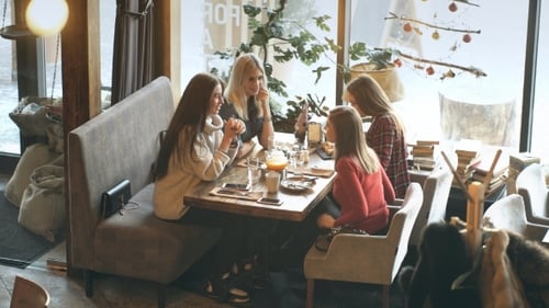 Four Female Friends Enjoying in Talking at Cafe