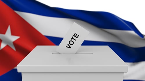 Casting Vote into Ballot Box with Waving Cuban Flag Background