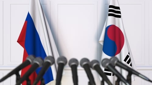 Flags of Russia and Korea at International Press Conference