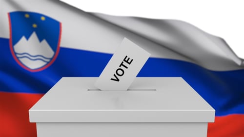 Slovenian Election: Vote Paper Dropping into Ballot Box