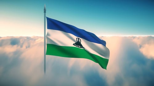 Majestic Lesotho Flag Waving Above Clouds Seamless Loop
