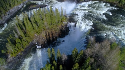Aerial View of a Waterfall in Lush Forest