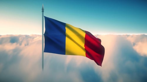 Waving Romanian Flag Against Sky and Clouds