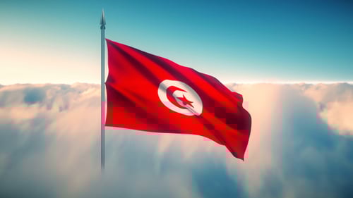 Tunisian National Flag Waving Over Blue Sky and Clouds