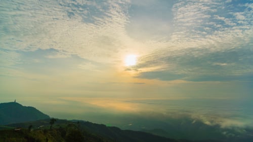 Mountain Range at Sunrise with Foggy Valleys