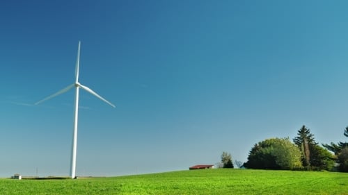 One Industrial Wind Generator on a Green Meadow. Alternative Sources of Clean Energy