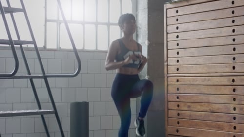 Young Fit and Tone Up Woman Doing Heating Before a Fitness Workout in Sunny Loft