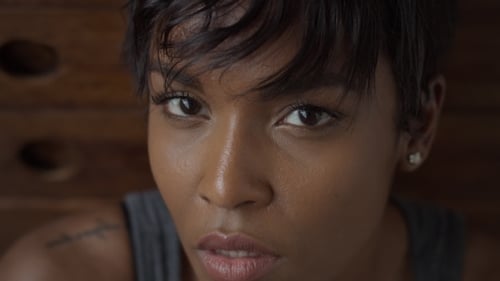 Young Woman Looks Upward Close Up Shot