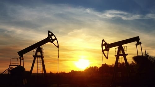 Oil Pumps Silhouetted Against Sunrise or Sunset