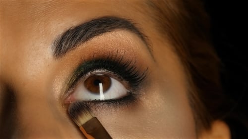 Girl with Make Up Looking Up, Visagiste Brush Adjusts Her Make Up