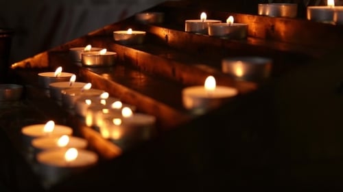 Lighted Candles in the Temple in the Twilight