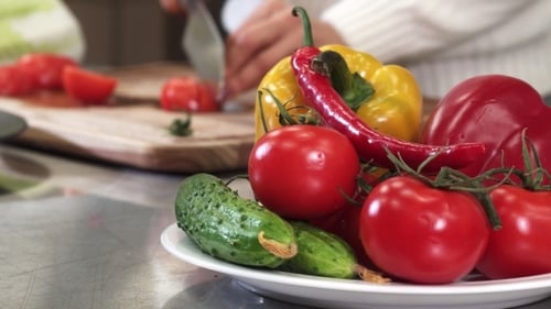Woman Cooking Vegetarian Food at Home Delicious Vegetables on the Front