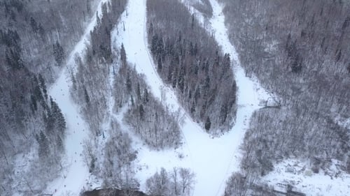 Drone View Winter Skiing and Snowboarding on Ski Slope in Winter Resort