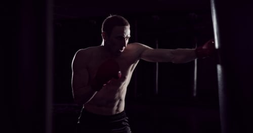 Boxer Punching Bag Sequence Strong Athlete Hits a Punching Bag Kickboxing Men Training Punchin
