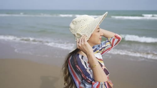 4K Portrait of Beautiful Caucasian woman walking on tropical beach in summer sunny day