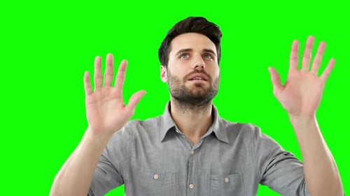 Man pretending to touch an invisible screen