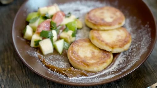 Woman Eating Tasty Pancakes Crepes with Berries on Table Closeup Close