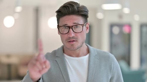 Man Expressing Rejection, Raising Index Finger