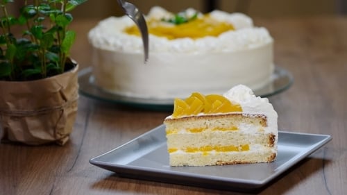 Fork Takes a Bite of Layered Cake Slice