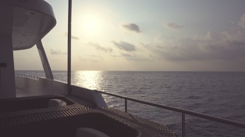 Yacht Sailing on Ocean at Sunset