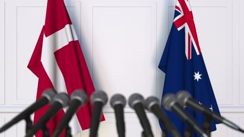 Denmark And Australia Flags Waving For Diplomatic Meeting