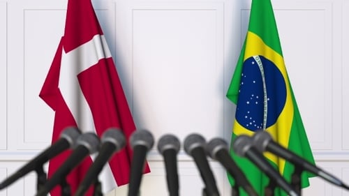 Denmark and Brazil Flags Waving at Diplomatic Press Conference