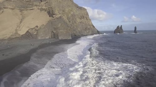 Black beach with big waves and cliffs in Vik, Iceland - Beautiful Icelandic s