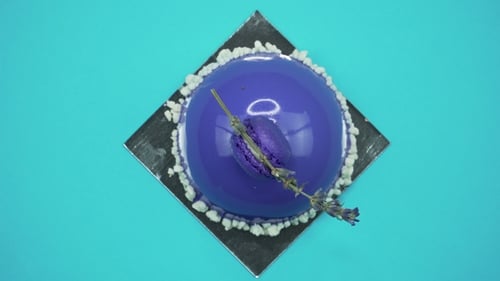 Purple Dome Dessert Rotating on Teal Background
