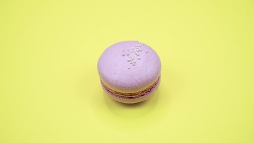 Pink Macaron Zooming on Yellow Background