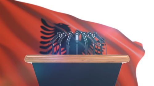 Podium with Microphones and Waving Flag Background for Broadcasts