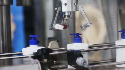Automated Robotic Arm Assembling Bottles on Factory Line