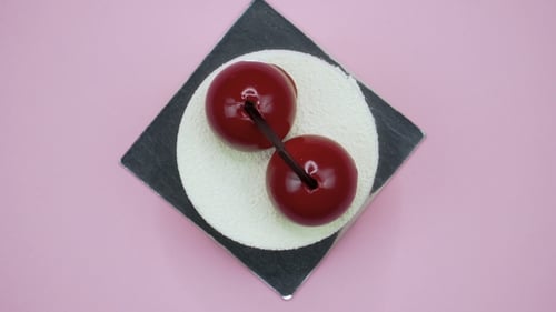 Bright and Colorful Cake on a Pink Background. Rotating Top View.