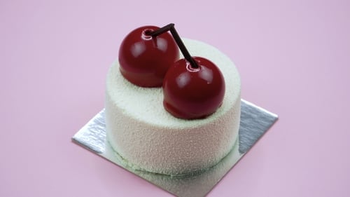 Bright and Colorful Cake on a Pink Background. Rotating Top View.