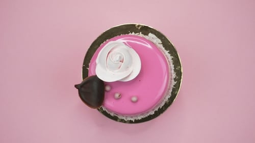 Bright and Colorful Cake on a Pink Background. Rotating Top View.