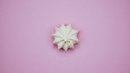 Bright and Colorful Marshmallow Shot on a Pink Background. Rotating Top View.