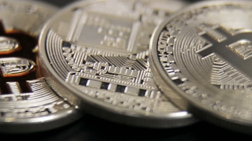 Silver and Gold Bitcoin Coins Macro Shot
