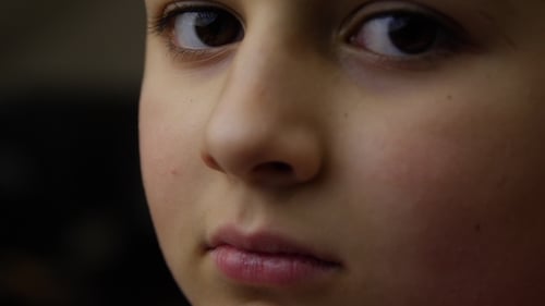 Face of Young Boy Is Looking at You