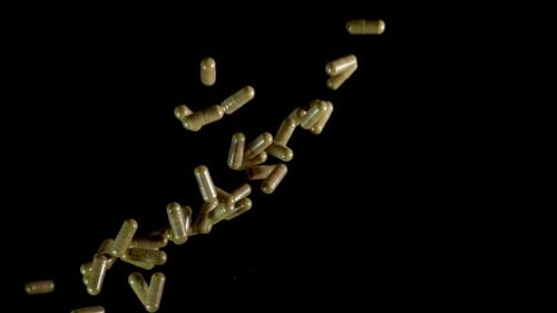 Pill Capsules are Thrown Into the Air