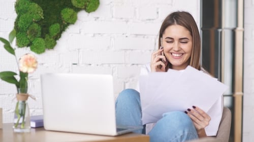Woman Working from Home Talking on Phone