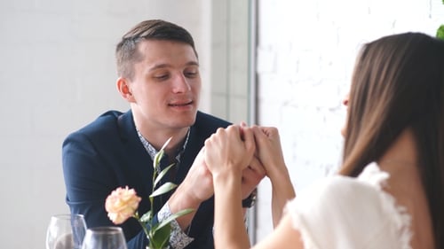 Couple Celebrate Valentine's Day with Romantic Dinner in Restaurant