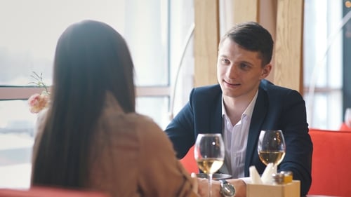 Couple Celebrate Valentine's Day with Romantic Dinner in Restaurant