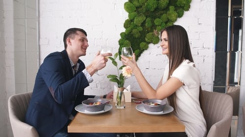 Couple Celebrate Valentine's Day with Romantic Dinner in Restaurant
